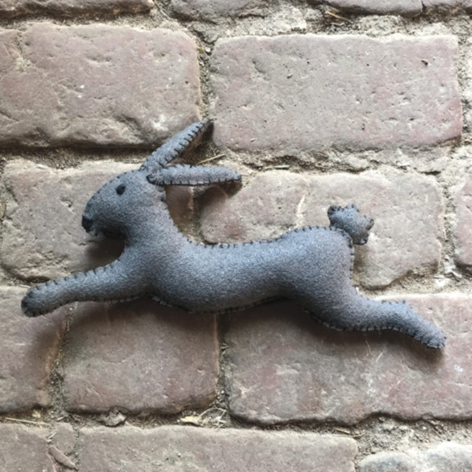 Rabbit leaping grey